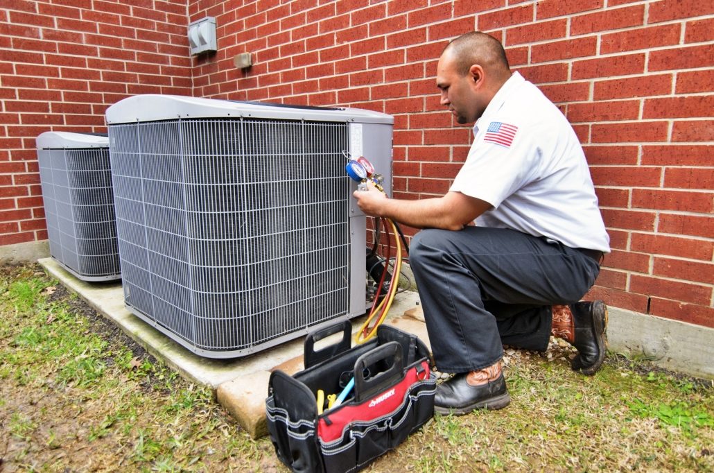 HVAC technician providing AC tune-up