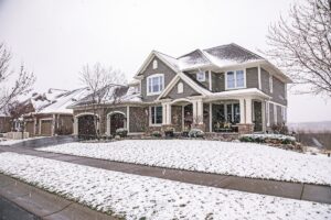 Snowy exterior of a two-story home