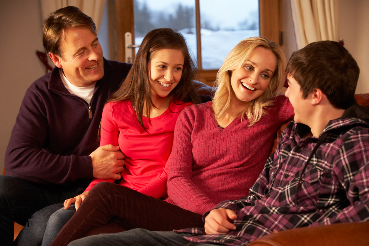 Family sitting on a sofa