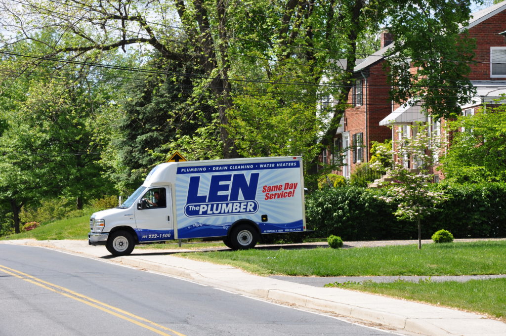 Len The Plumber truck pulling out of Northern VA homeowner's driveway.